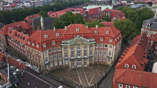 An aerial view of the Erbdrostenhof, a late Baroque palace with three wings located in Münster, North Rhine-Westphalia, Germany. 