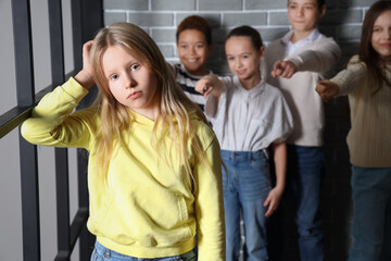 Bullied little girl at school - obrazy, fototapety, plakaty