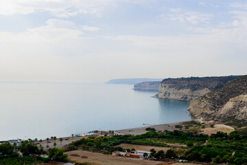 Obraz premium Landscape with huge rocks and view on small village near the sea in Cyprus