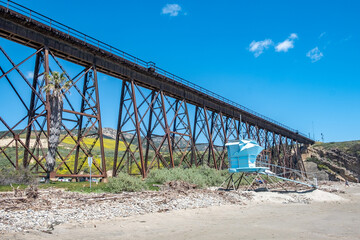 old railway bridge and beach with lifeguard tower at Gaviota at cabrillo Highway, California...