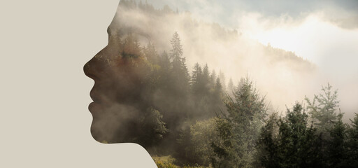 Double exposure of beautiful woman and mountain foggy forest. Banner design