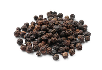 Aromatic spice. Many black dry peppercorns isolated on white