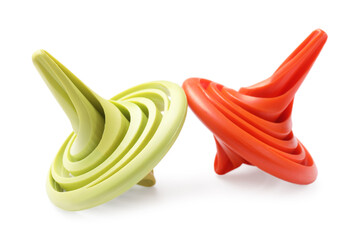 Two colorful spinning tops on white background