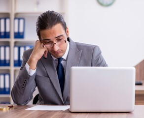 Unhappy male businessman in the office - 782613569