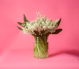 Fotobehang bouquet of lilies of the valley in a vase © serhii