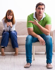 Young couple in gadget dependency concept - 782622733