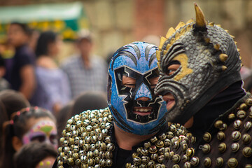 Men with masks in Catrinas parade in Mexico