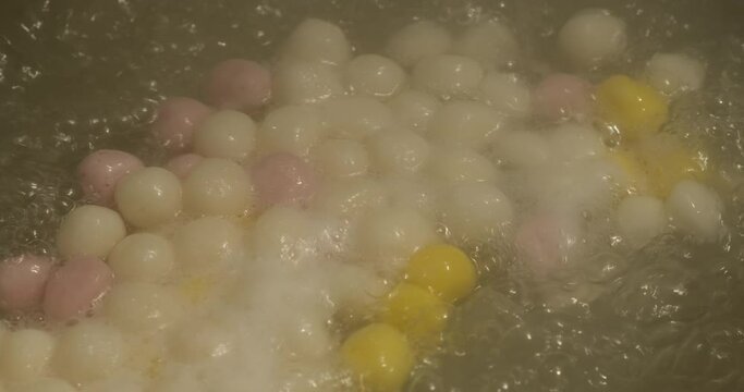 cooking sweet glutinous rice dumplings. Traditional Chinese food in Lantern Festival. slow motion