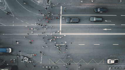 Top down pedestrians crosswalk road aerial. People cross street. Cityscape crossroad. Men, women...