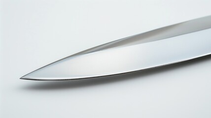 Close-up of sharp knife edge against white background