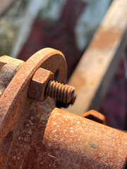old rusty metal bolt of machine