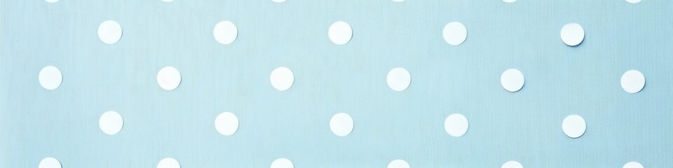 A banner featuring a light blue background with playful white polka dots. Banner. - obrazy, fototapety, plakaty