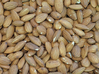A Large Pile of Almonds on a Store Counter Fresh and Aromatic Nut for Healthy Eating