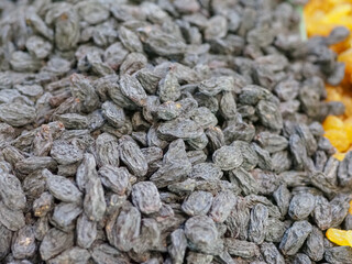 Dark Raisins Against - A Symbol of Nature’s Energy and Sweetness