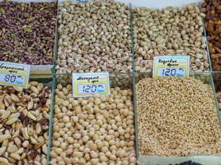 Market Display of Nut Variety: Pistachios, Macadamia, Pine Nuts