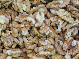 “Close-up of Walnut Kernels on a Dark Background, Symbolizing Natural Strength and Energy”