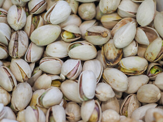Close-Up of Unshelled Pistachios: A Symbol of Natural Energy and Festive Mood