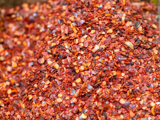 Patterns of Red and Orange Ground Spices on a Kitchen Table