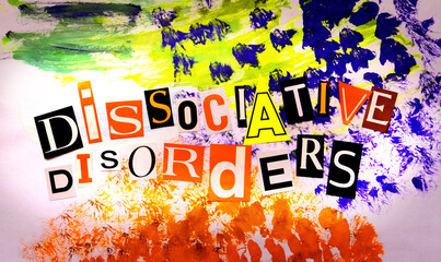 Text Dissociative Disorders. Headline on colorful painting background. Mental health concept