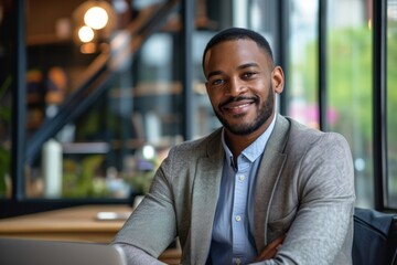 Fototapeta premium Portrait of smiling businessman boss standing in his modern business company office
