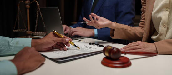 A lawyer, investor, businessman, or entrepreneur is reviewing a business contract or insurance...