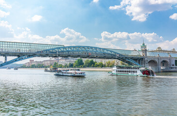 Obraz premium View of the Moscow river embakment, Pushkinsky bridge and cruise ships at sunset.