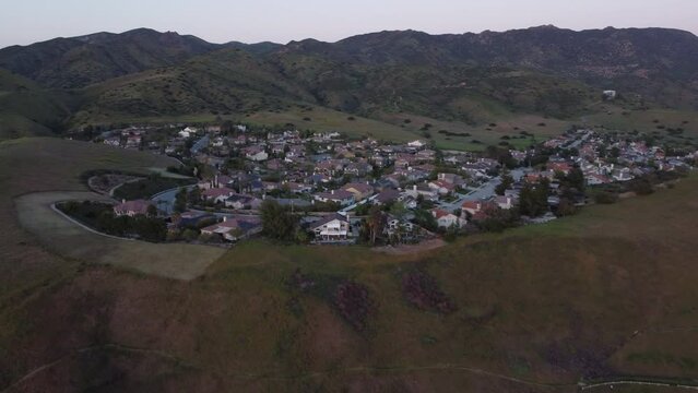 Mountains and homes in Simi Valley, California in the evening. 4K drone footage.