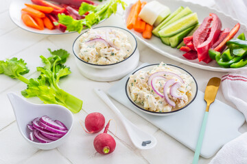 Fish and egg paste or salad with raw snack vegetables, healthy snack