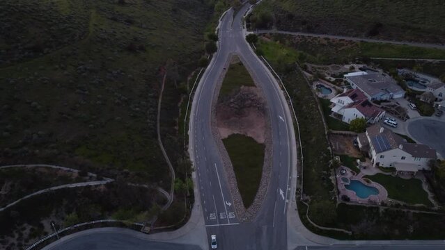 Road splits around live oak tree in Simi Valley, CA