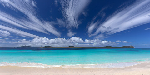 A beautiful blue ocean with a few clouds in the sky