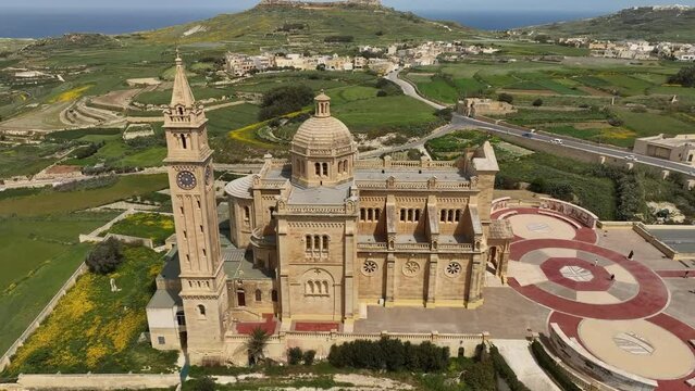 Drone reveals Basilica of the Blessed Virgin of Ta' Pinu with agricultural fields in Gharb, Malta