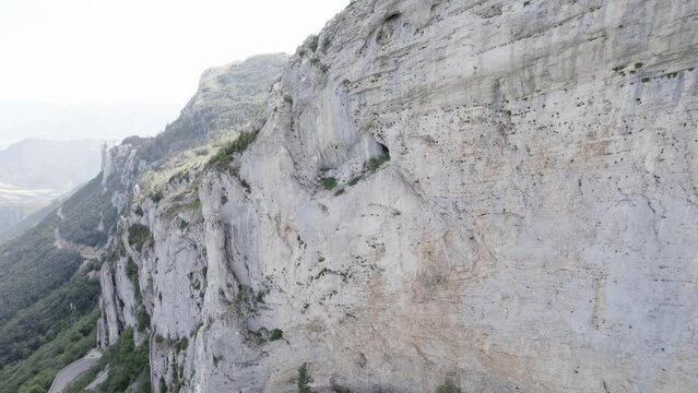 Aerial Shot Of Steep Limestone Cliff at Vercors Mountains At Col De Rousset At Sunset