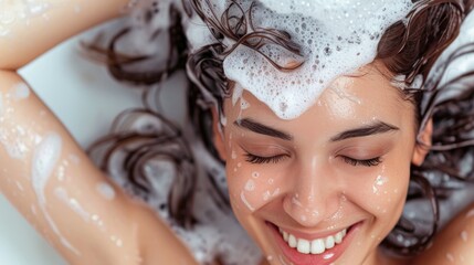 woman in shower, A close-up of a woman washing her hair, there is a lot of foam on her hair and she is smiling. 