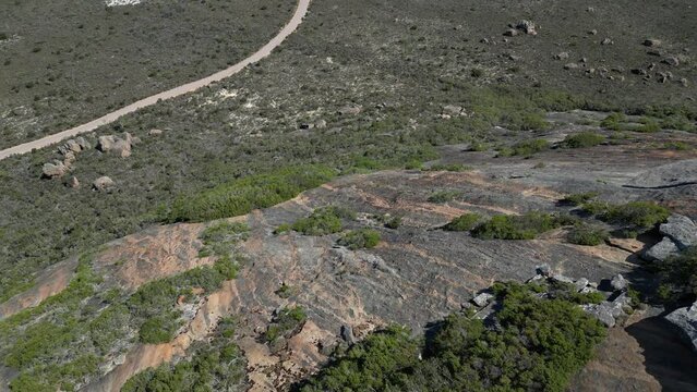 Aerial tilt down shot of rocky frenchman mountain in Cape Le Grand Area, Western Australia.