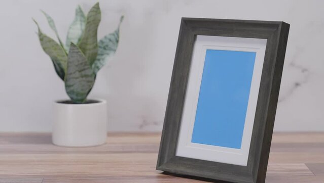 Black frame with blue screen on white background | 4K