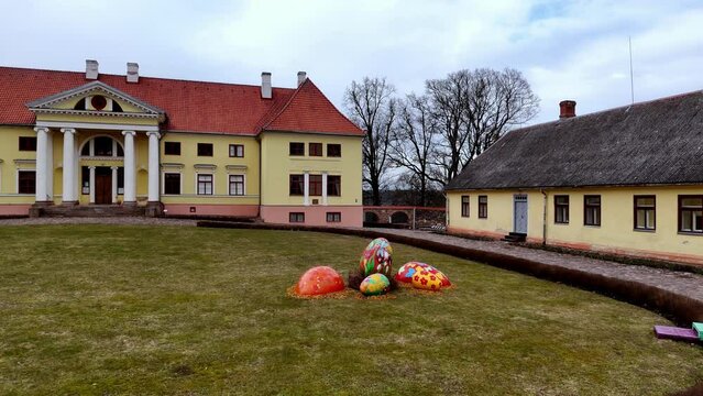 Durbe Castle Garden Decorated With Colorful Giant Eggs For Easter Celebration In Estonia, Latvia. Static Shot
