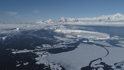 Arctic Polar Mountain Coast Aerial View. Snow Covered Antarctica Ocean Landscape Overview. North Nature Horizon Stunning Panorama Drone