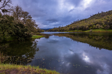 Fototapeta na wymiar Beautiful twilight over calm Lake Hennessey in California in springtime