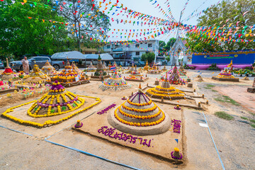 PHITSANULOK, THAILAND - April 9,2024:Thai people come to build the sand Pagoda for return the sand to the temple on Songkran festival Thai tradition at Ratchaburana temple in Phitsanulok,Thailand.