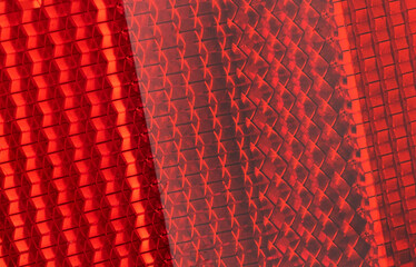 Safety reflector texture background. Light red reflector pattern