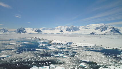 Antarctica Peninsula Ocean Shore Seascape Aerial View. Arctic Majestic Brash Ice Floe on Mountain...