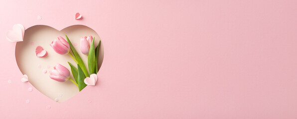 Valentine's Day romance concept. Top view image of tulips, and paper hearts, seen through...