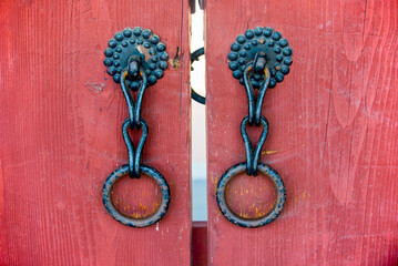 Korean traditional knocker. Ancient knocker. A traditional lock on a wooden door. Korean traditional lock.