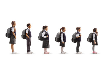 Full length profile shot of schoolchildren waiting in line