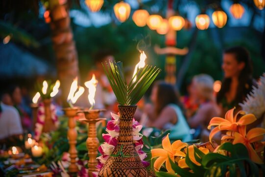 A birthday party with tropical decorations, torches, and guests wearing leis