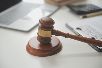 Lawyer, legal advisor, businessman brainstorming information on agreement details Business contracts in legal processing books for accuracy in contract documents. joint financial investment.