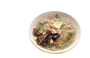 Clear vermicelli soup with minced pork, dried shrimp,mushroom, other ingredients in bowl, isolated on white background. Concept, Thai local cuisine food. Delicious menu with nutritious. Easy to cook. 