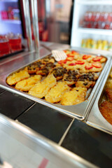 Bustling Cafeteria Serving Line During Lunchtime Offering a Variety of Dishes
