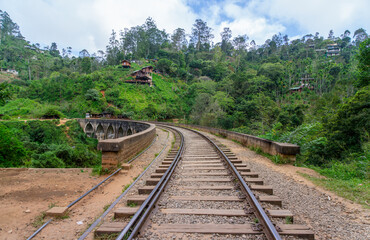 A captivating view of the Nine Arch Bridge, in Demodara, Sri Lanka. The high arch bridge, made of cement and bricks, dates back to the British colonial period.