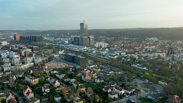 Aerial the dynamic urban landscape of Oliwa, a district of Gdańsk, contrast between modern high-rise architecture and traditional housing, Olivia Business Centre (OBC) towering over the scene